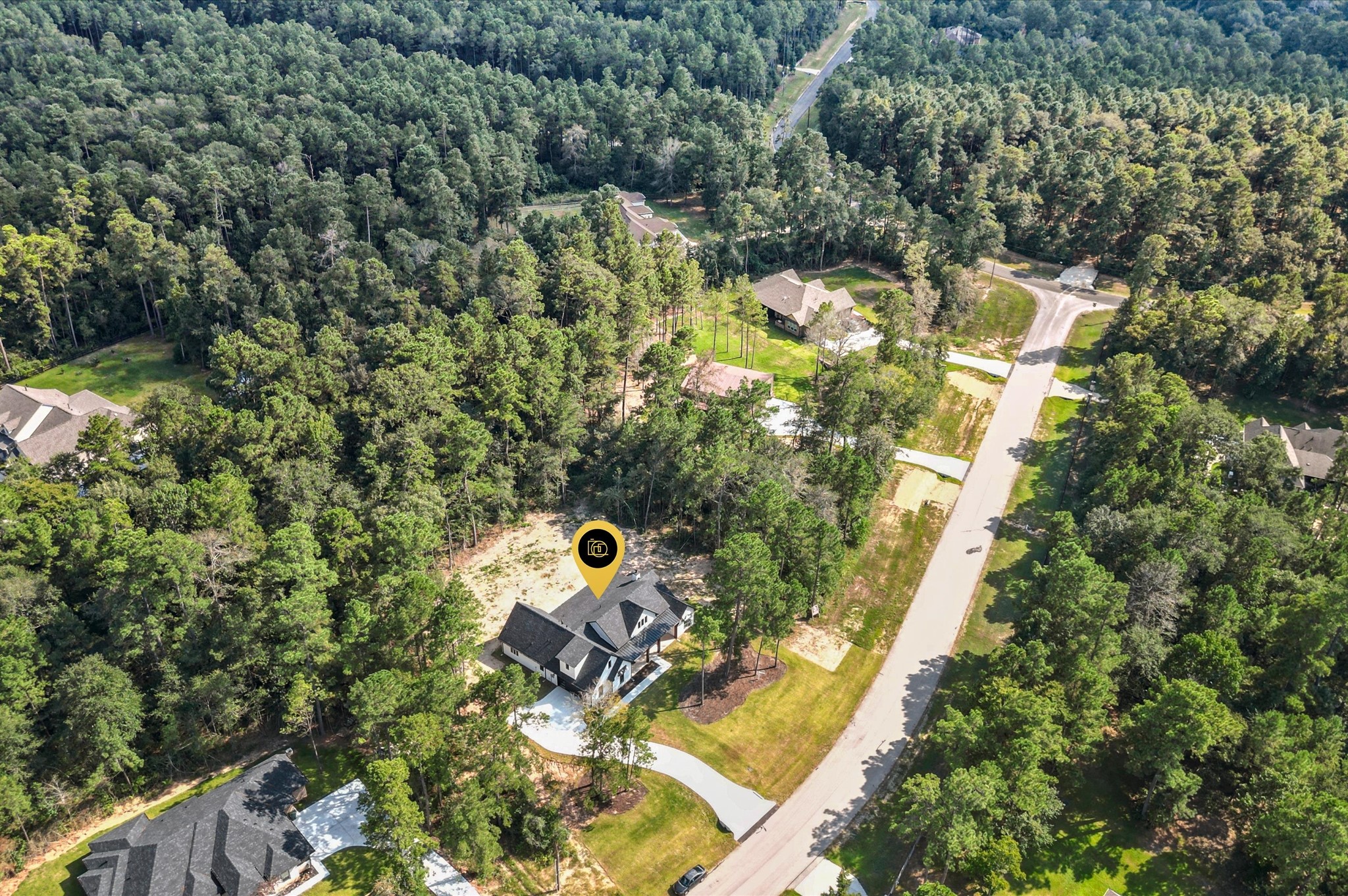 118 Ranger Road Huntsville, TX 77340 - Photo 2 of 49 an aerial view of a house with a yard and swimming pool