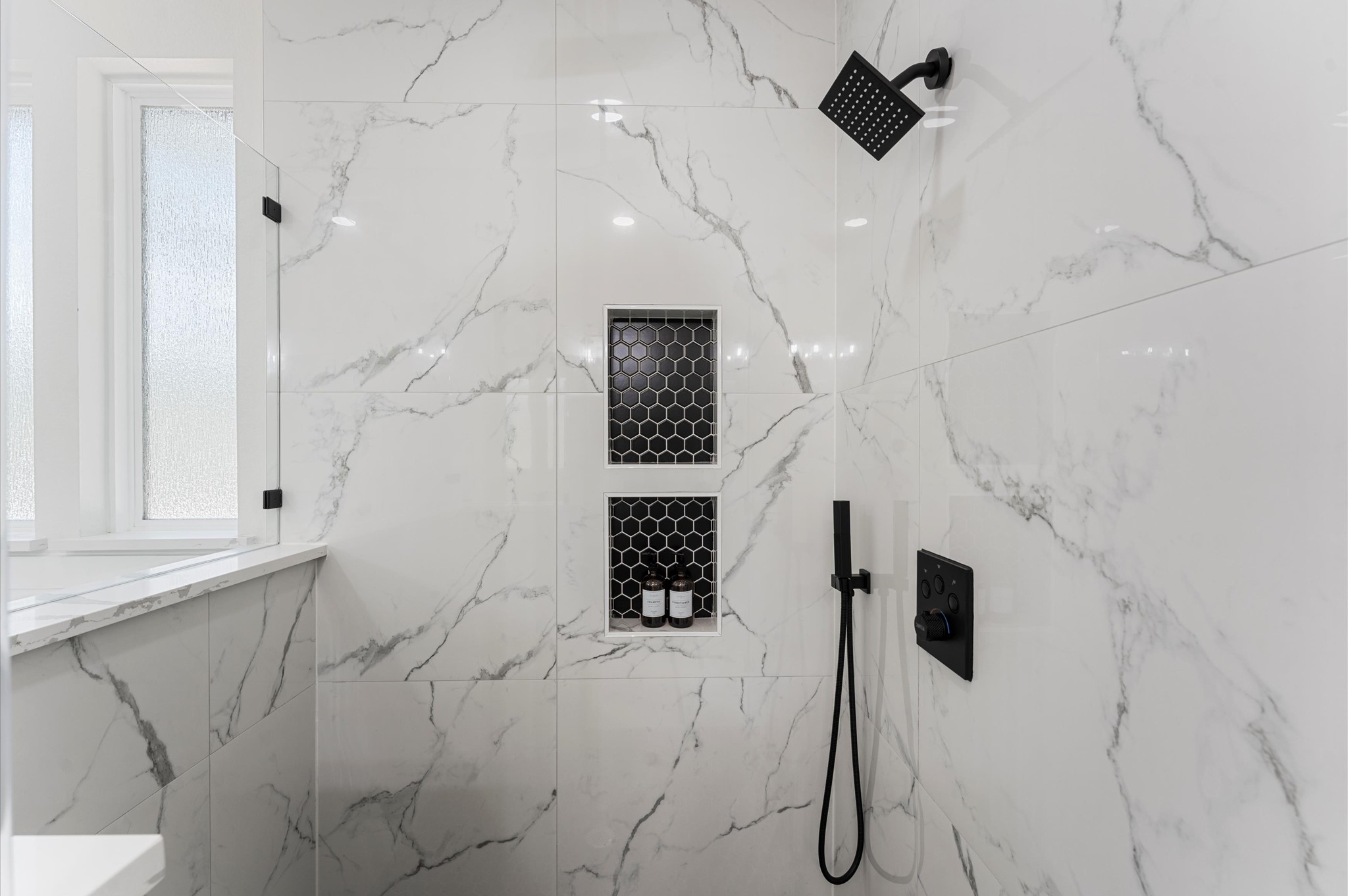 118 Ranger Road Huntsville, TX 77340 - Photo 30 of 49 Spa-inspired bath with walk-in shower, soaking tub, double vanities, quartz counters, and luxury finishes.