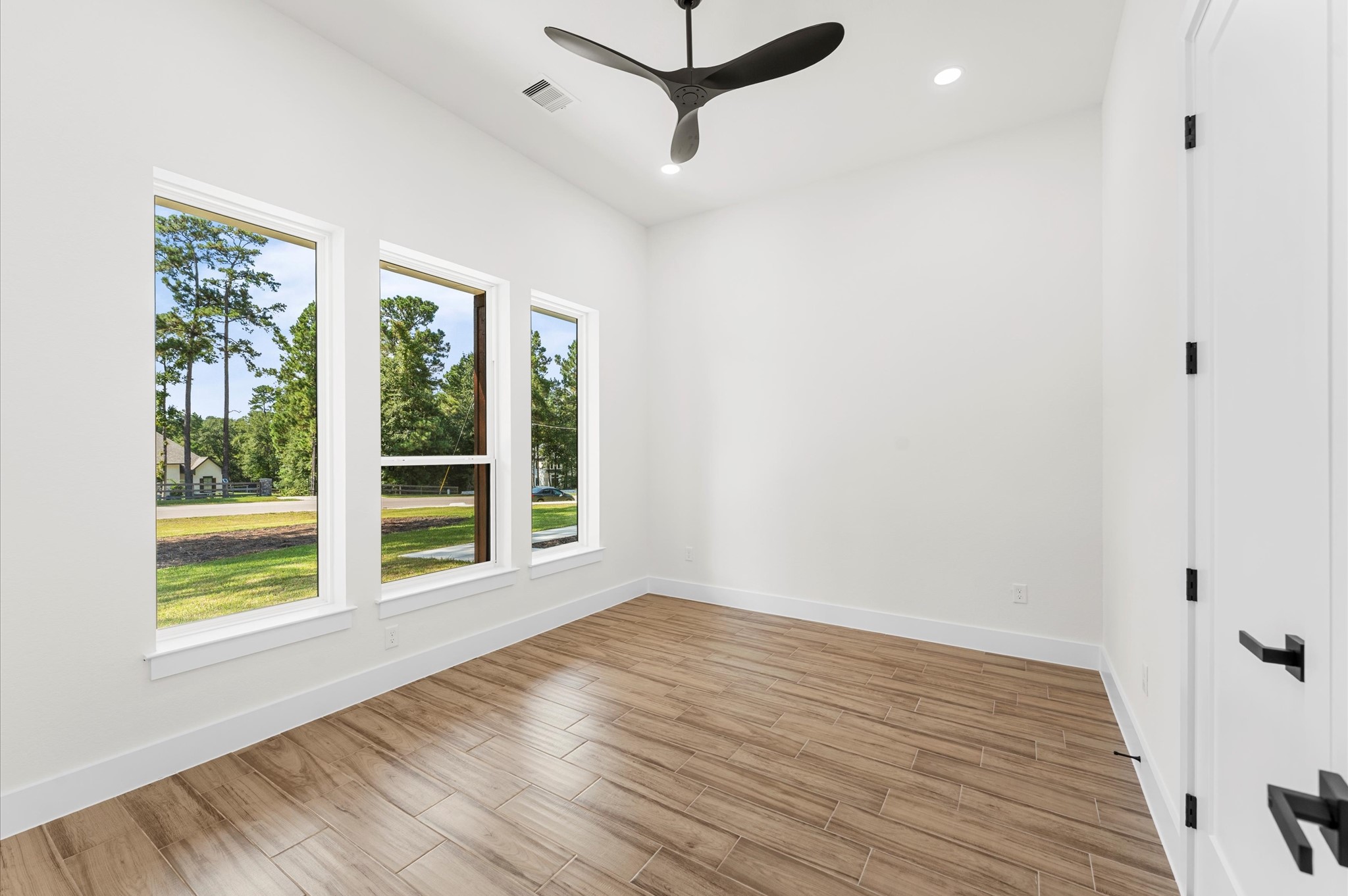 118 Ranger Road Huntsville, TX 77340 - Photo 34 of 49 a view of a room with wooden floor and windows