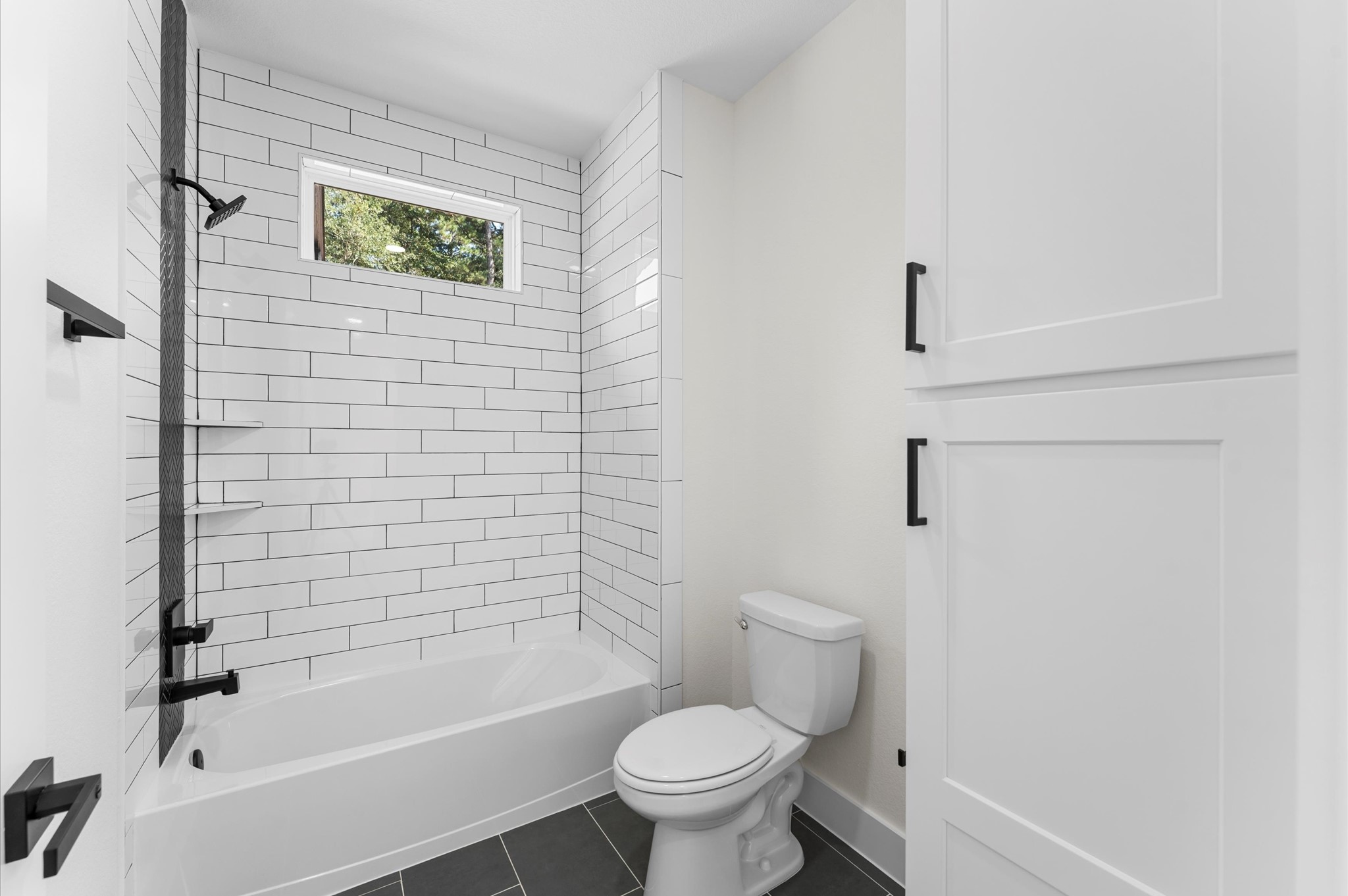 118 Ranger Road Huntsville, TX 77340 - Photo 36 of 49 a bathroom with a toilet and a shower