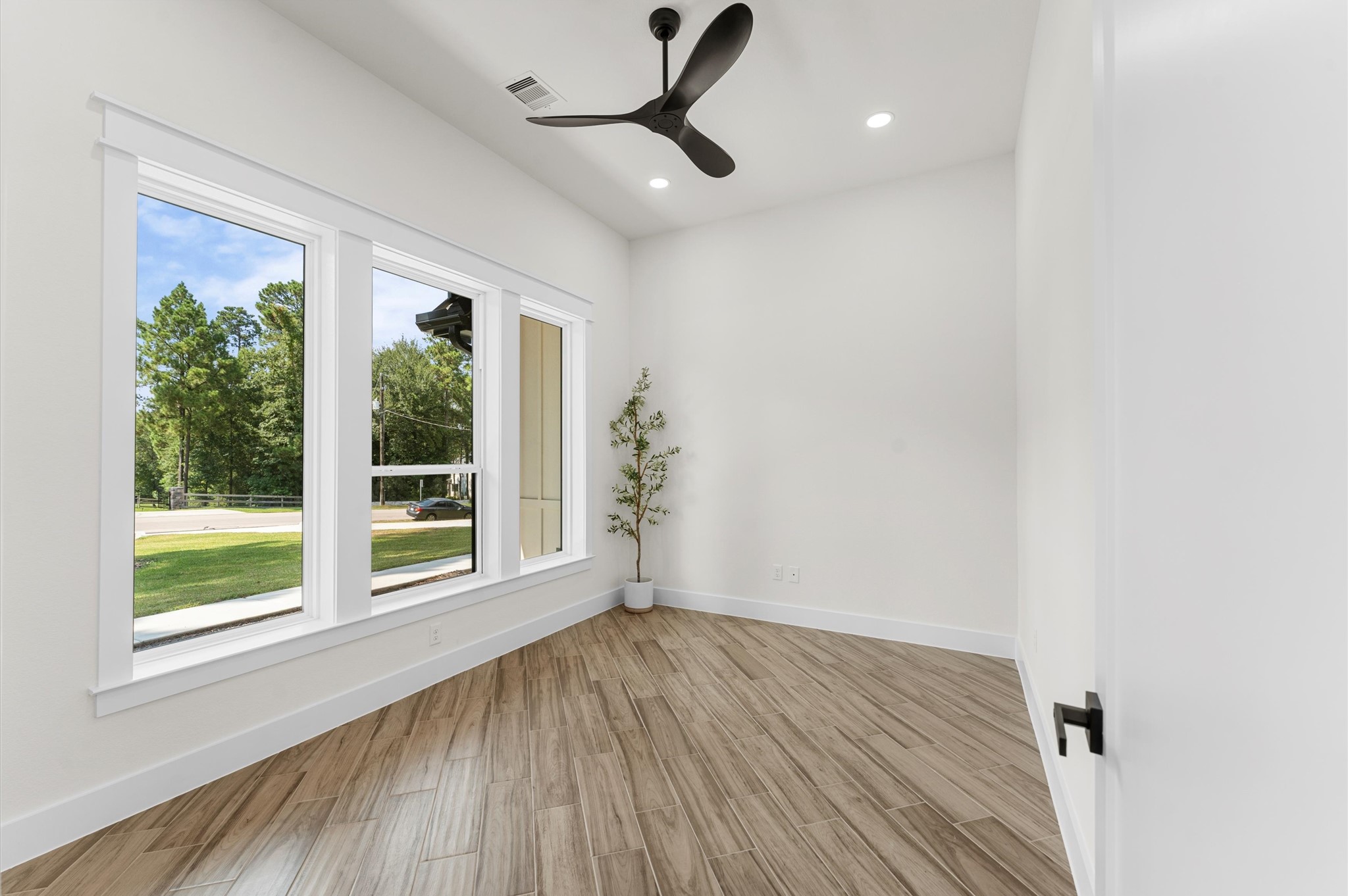 118 Ranger Road Huntsville, TX 77340 - Photo 37 of 49 a view of empty room with wooden floor and fan