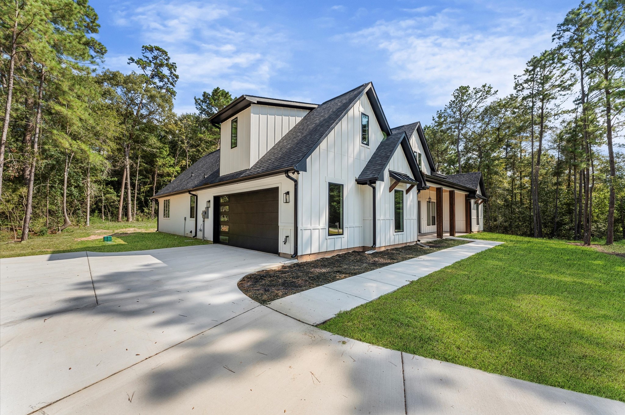 118 Ranger Road Huntsville, TX 77340 - Photo 4 of 49 a view of a house with a big yard plants and large tree