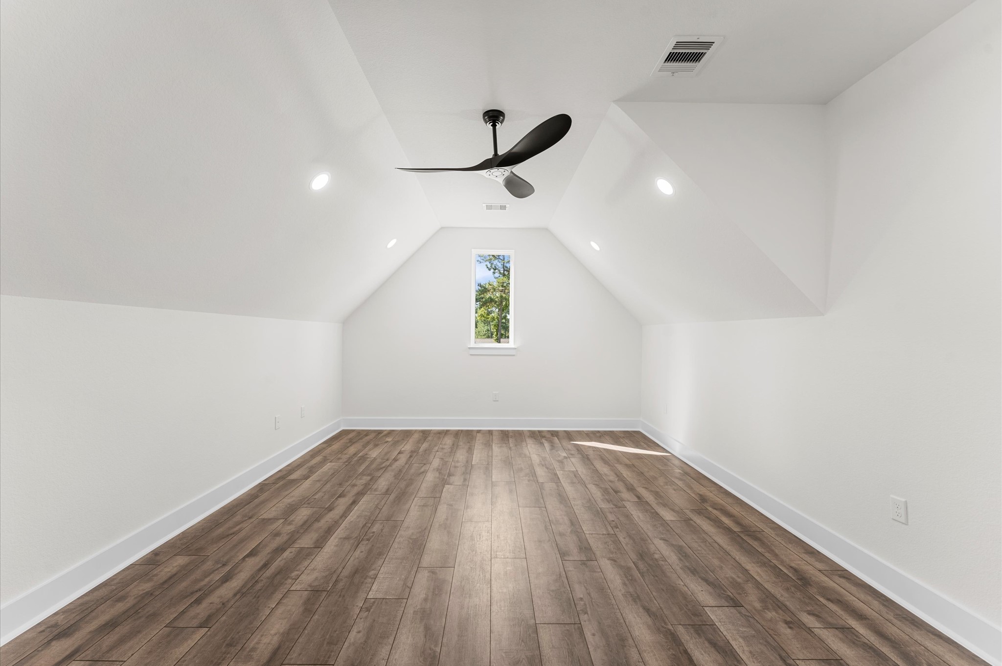 118 Ranger Road Huntsville, TX 77340 - Photo 41 of 49 an empty room with a window and a ceiling fan