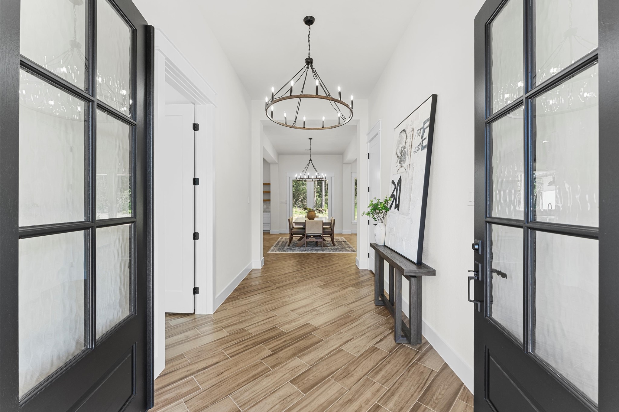 118 Ranger Road Huntsville, TX 77340 - Photo 6 of 49 a view of a hallway view with wooden floor and staircase