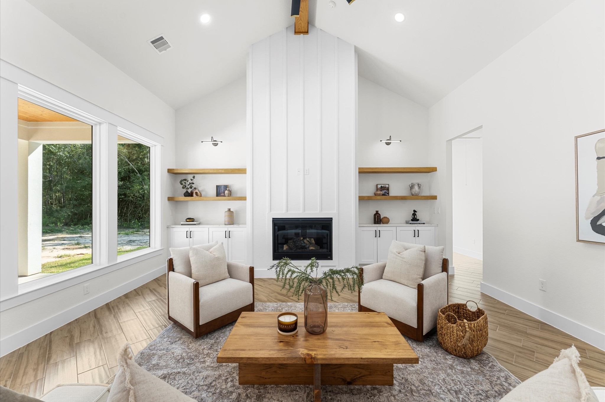 118 Ranger Road Huntsville, TX 77340 - Photo 8 of 49 a living room with furniture a fireplace and a floor to ceiling window