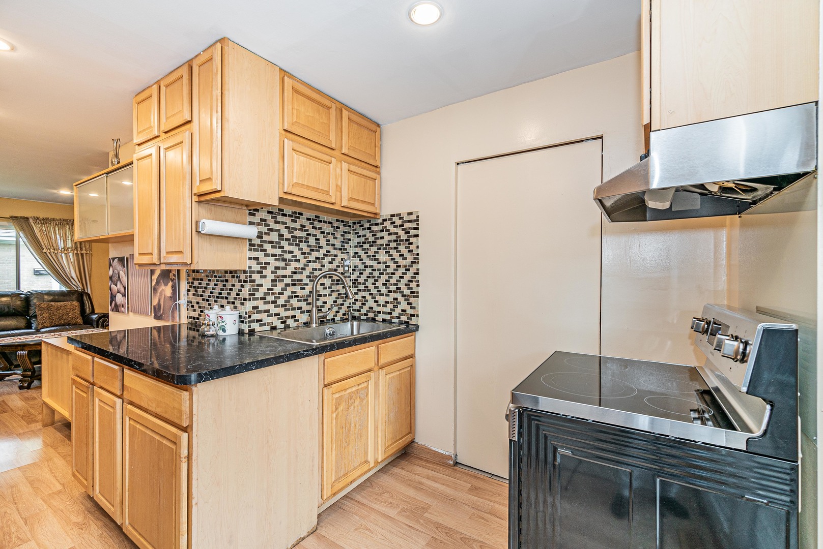 9415 Sumac Road, Unit A Des Plaines, IL 60016 - Photo 11 of 21 a kitchen with stainless steel appliances granite countertop a sink and cabinets