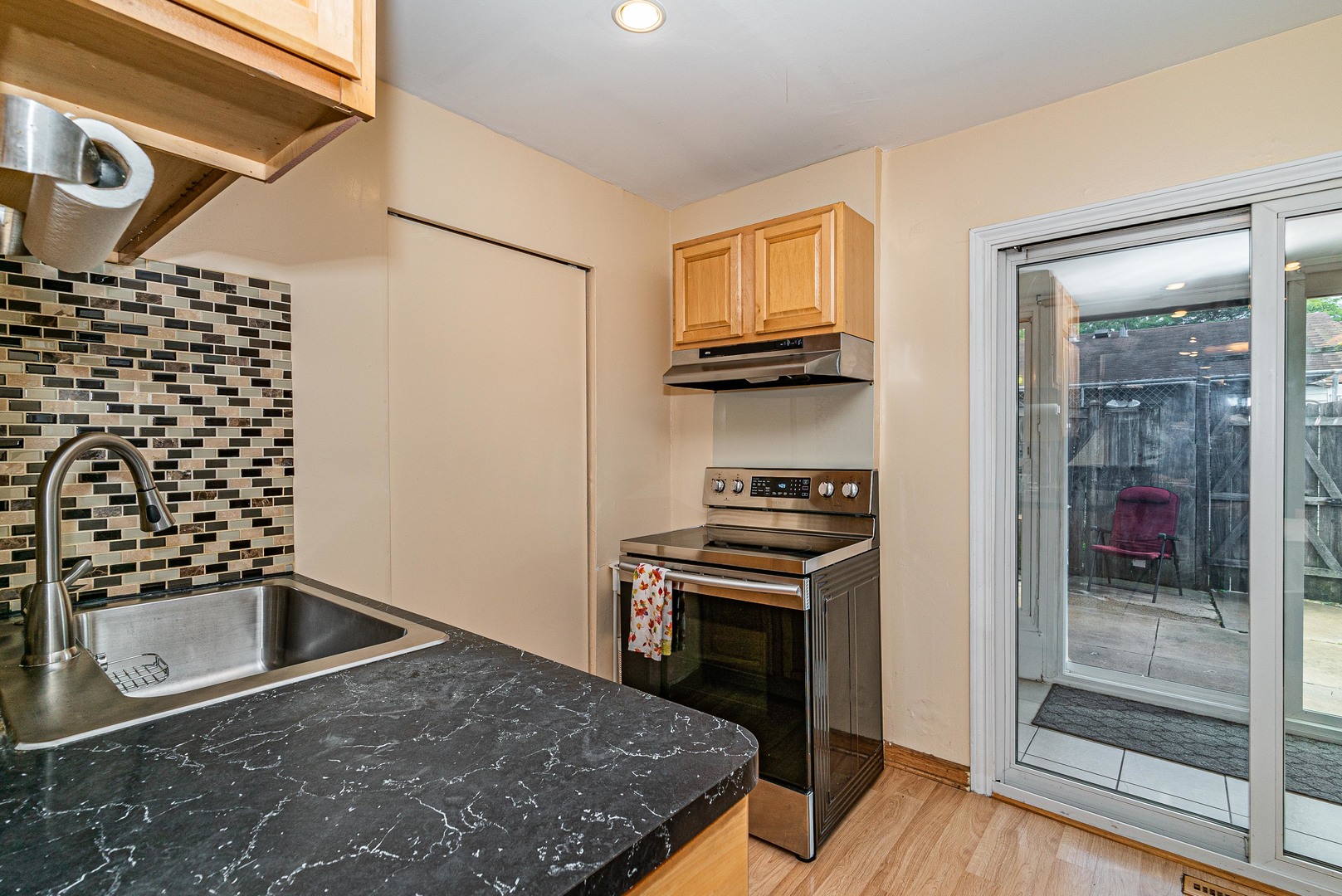 9415 Sumac Road, Unit A Des Plaines, IL 60016 - Photo 13 of 21 a kitchen with a stove and a refrigerator