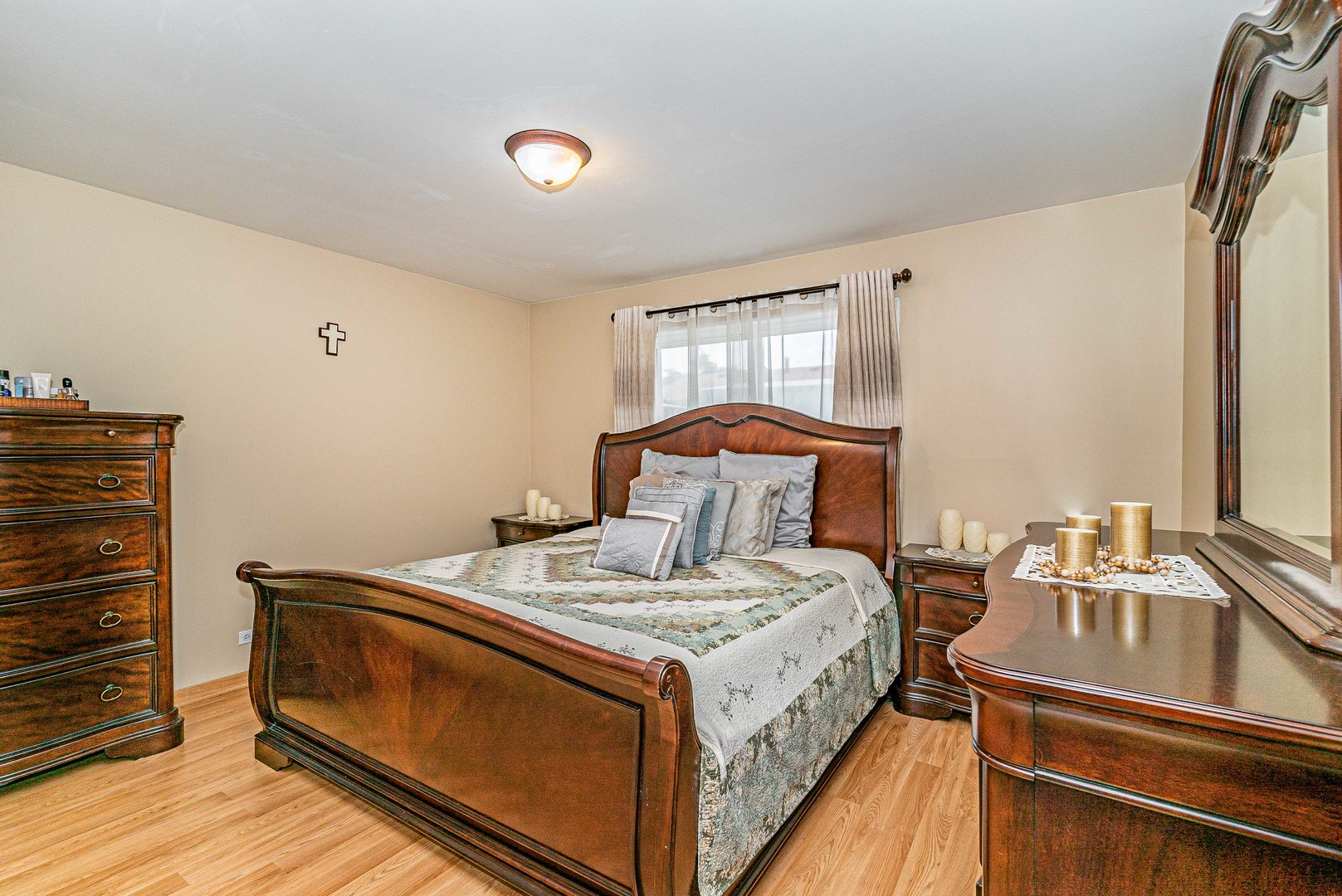 9415 Sumac Road, Unit A Des Plaines, IL 60016 - Photo 6 of 21 a bed sitting in a bedroom next to a window