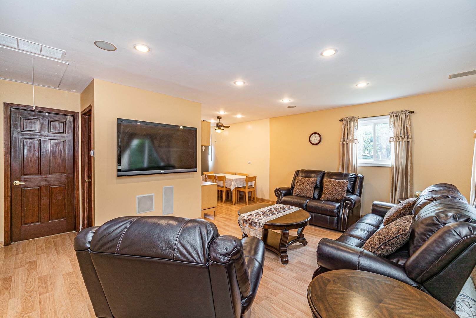 9415 Sumac Road, Unit A Des Plaines, IL 60016 - Photo 8 of 21 a living room with furniture and a flat screen tv