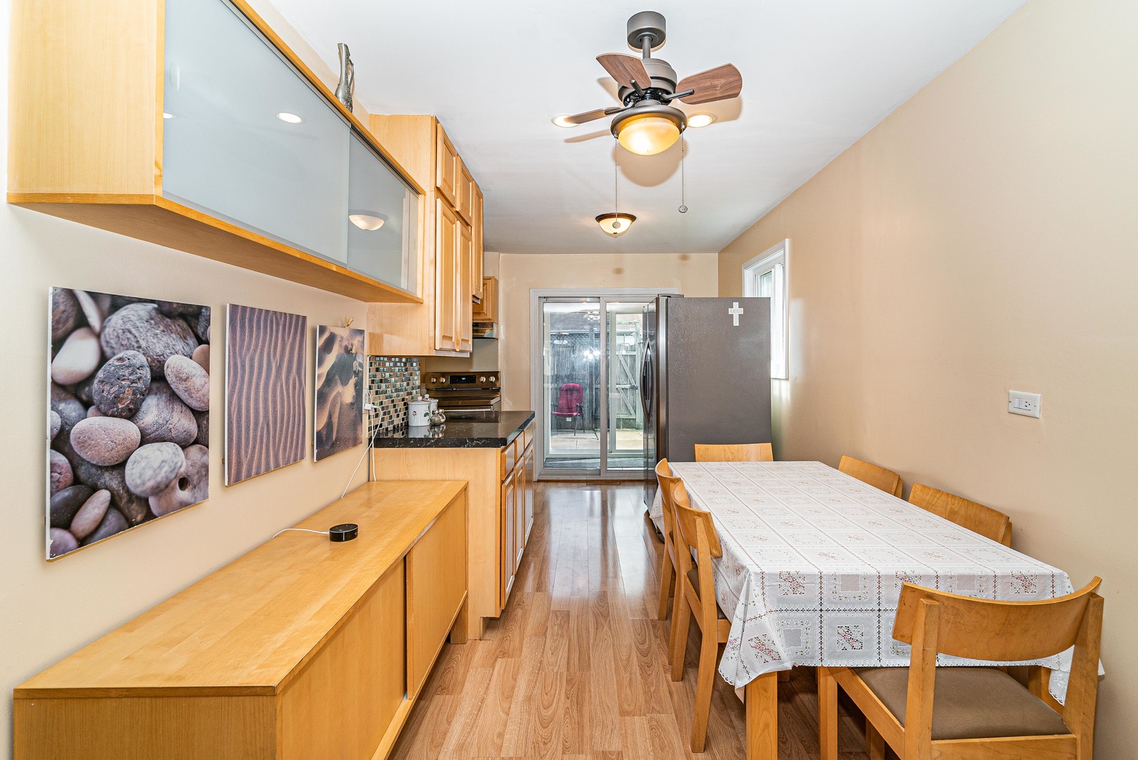 9415 Sumac Road, Unit A Des Plaines, IL 60016 - Photo 10 of 21 a dining room with wooden floor and furniture