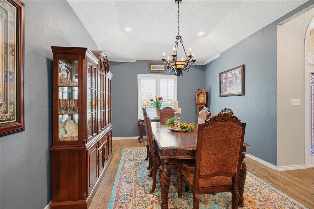 4612 100th Street Lubbock, TX 79424 - Photo 23 of 55 a view of a dining room with furniture window and wooden floor