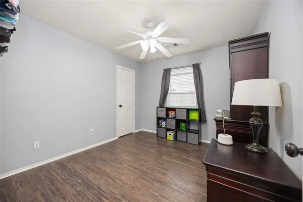 a work room with furniture and window