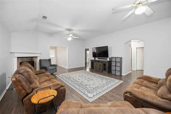 a living room with furniture and a flat screen tv