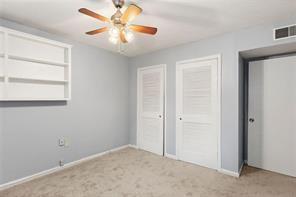 1822 North Rock Springs Road Northeast, Unit 7 Atlanta, GA 30324 - Photo 15 of 21 an empty room with windows and fan