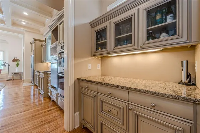 a spacious bedroom with a bed and a large window