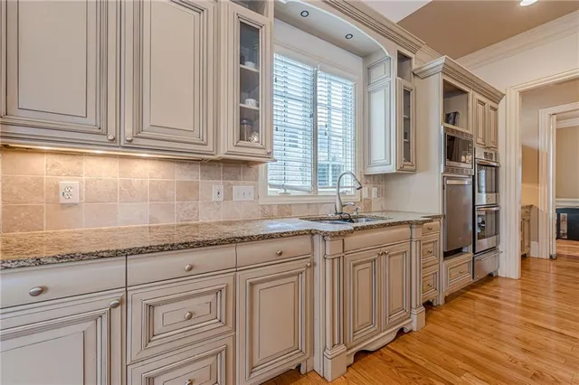 a view of a hallway with hallway and closet with wooden floor