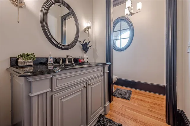 a bathroom with a toilet sink and shower