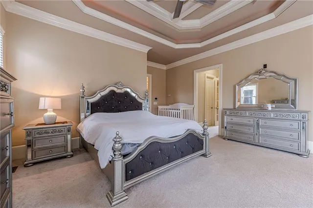 a living room with furniture and a ceiling fan