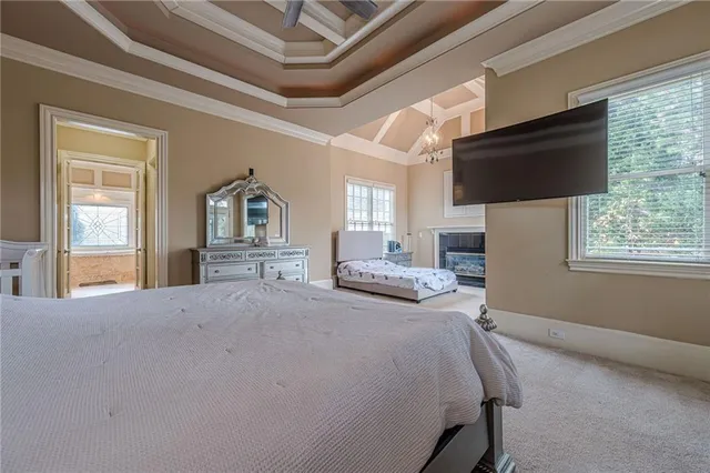 a kitchen with a sink and a stove top oven with wooden floor