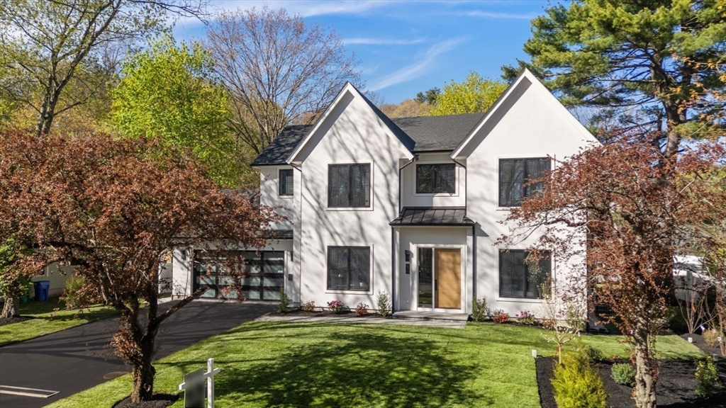 470 Quinobequin Road Newton, MA 02468 - Photo 1 of 37 a front view of a house with a yard