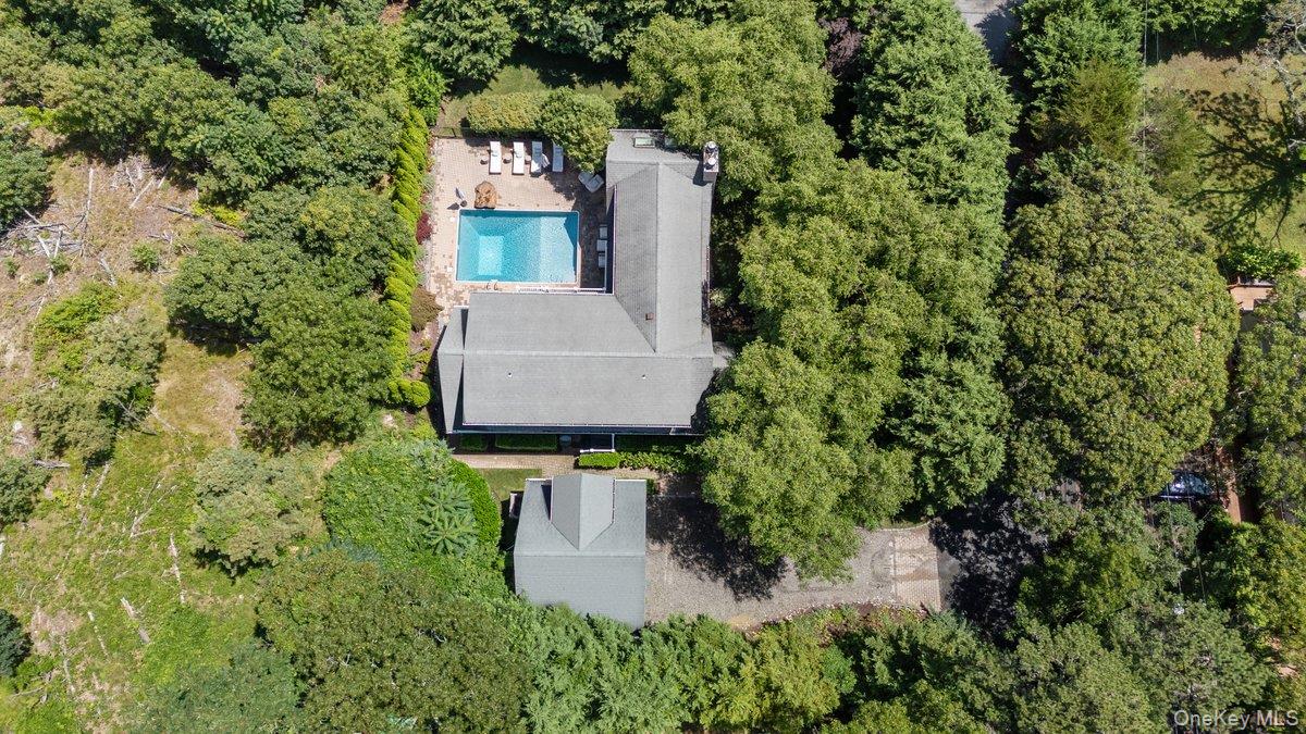2 Hubbard Street Hampton Bays, NY 11946 - Photo 1 of 1 an aerial view of a house with a yard and garden