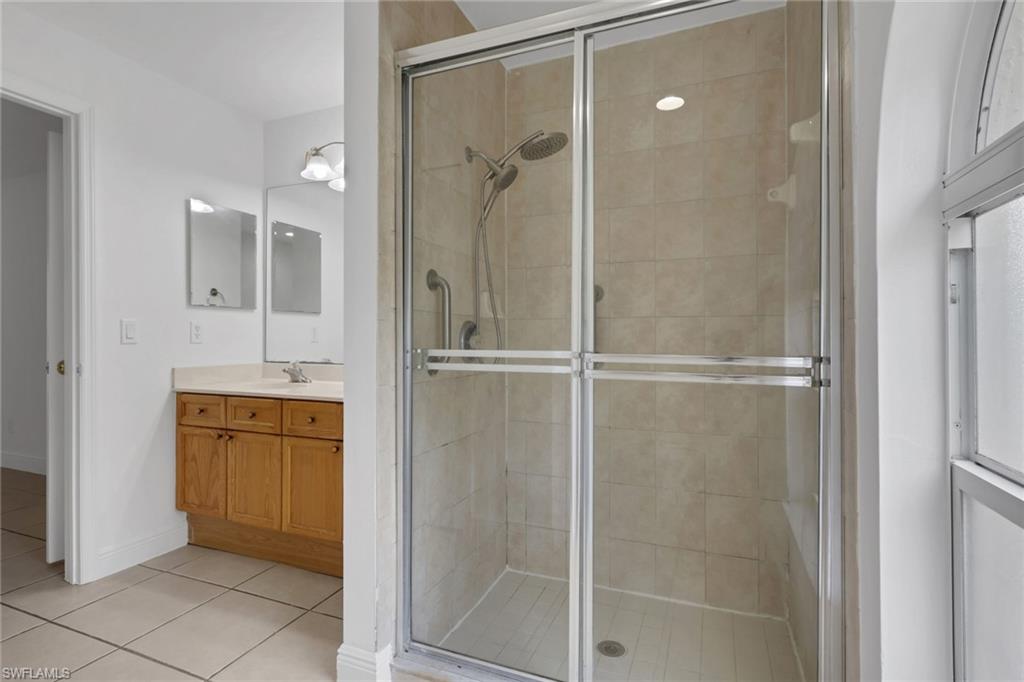 190 15th Street Southwest Naples, FL 34117 - Photo 14 of 26 a bathroom with a shower and a sink
