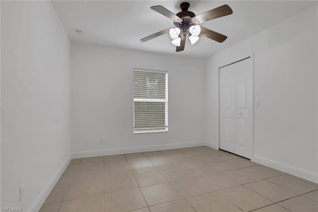 190 15th Street Southwest Naples, FL 34117 - Photo 15 of 26 a view of an empty room with a window