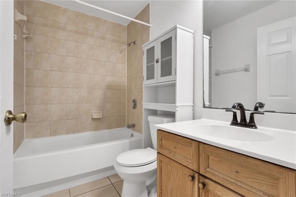 190 15th Street Southwest Naples, FL 34117 - Photo 16 of 26 a bathroom with a sink a toilet and a bathtub