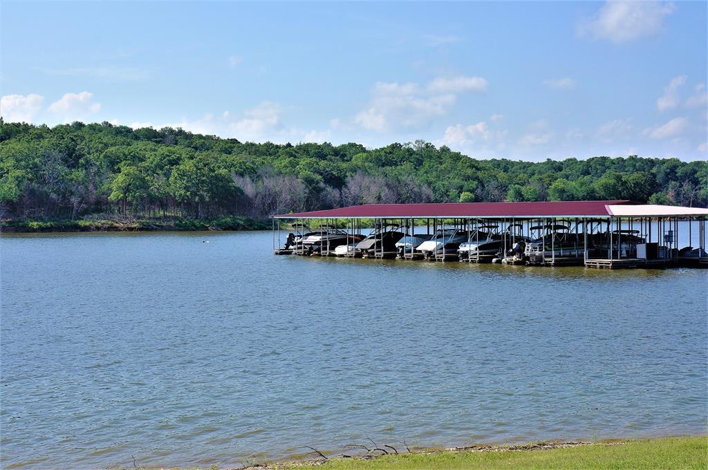 28 Windrose Loop Gordonville, TX 76245 - Photo 24 of 35 a view of a lake with houses in the background