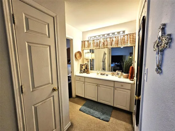 a bathroom with a double vanity sink and mirror