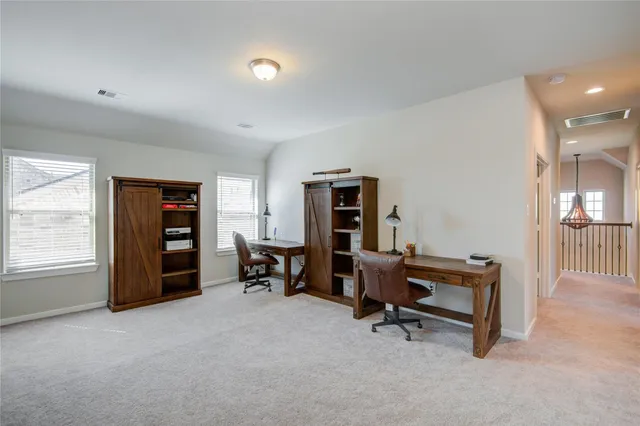 a view of a livingroom with furniture and a window