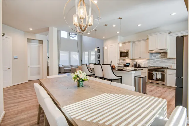 a kitchen with counter top space a sink appliances and cabinets