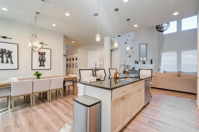 a large kitchen with lots of counter space and sink