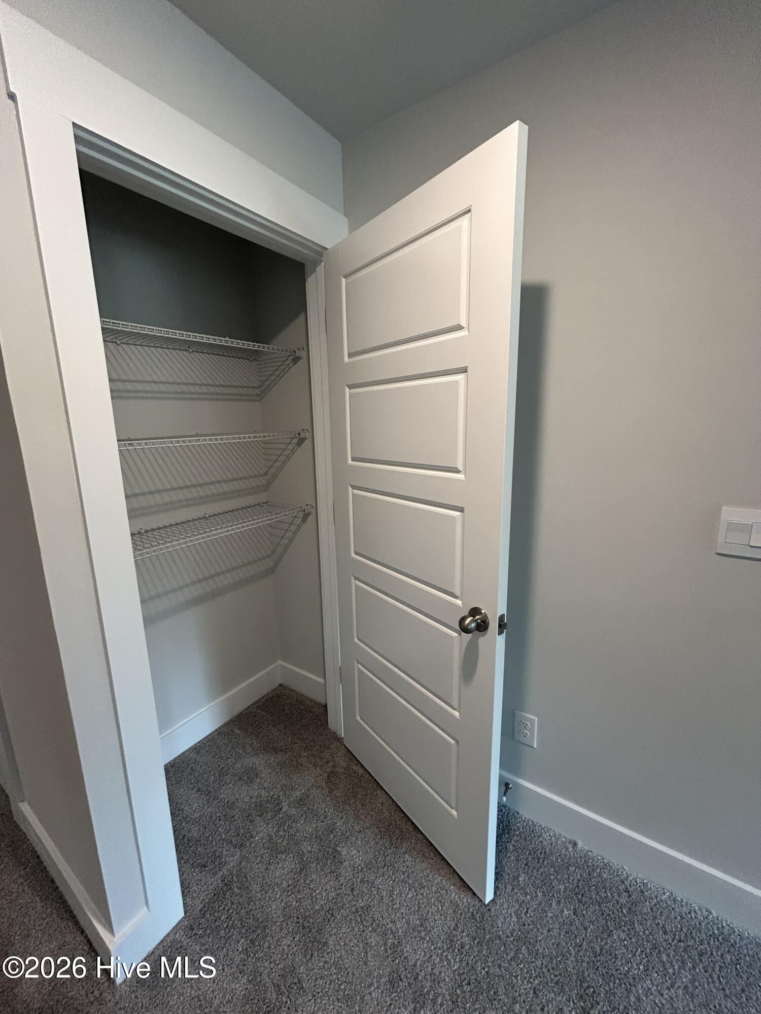 5784 Harebell Road Leland, NC 28451 - Photo 13 of 34 Hallway up linen closet