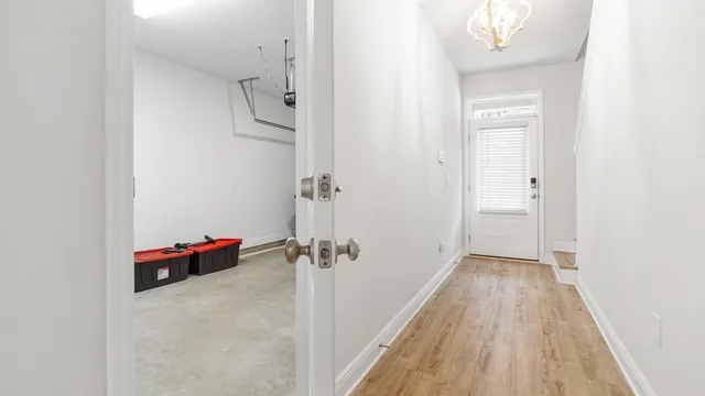 a view of a room with wooden floor