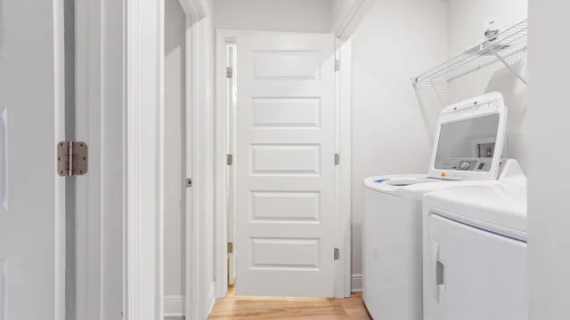 a bathroom with a sink a washer and dryer