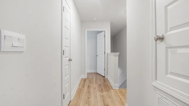 a view of a bathroom from the hallway