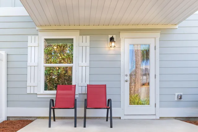 a view of a door and chair in the balcony