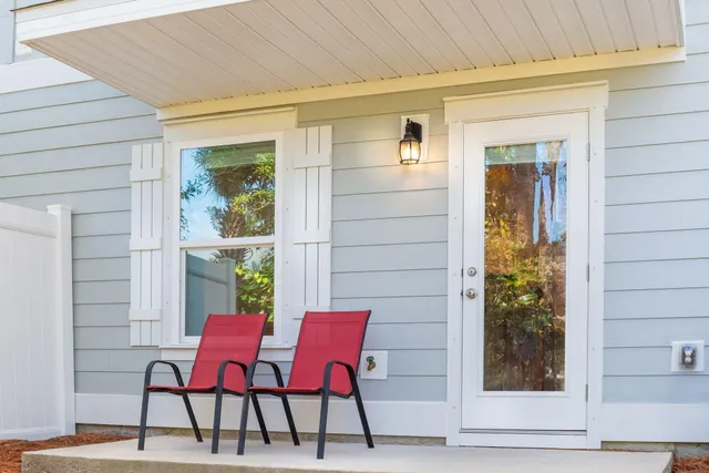 a view of a two chairs in the balcony