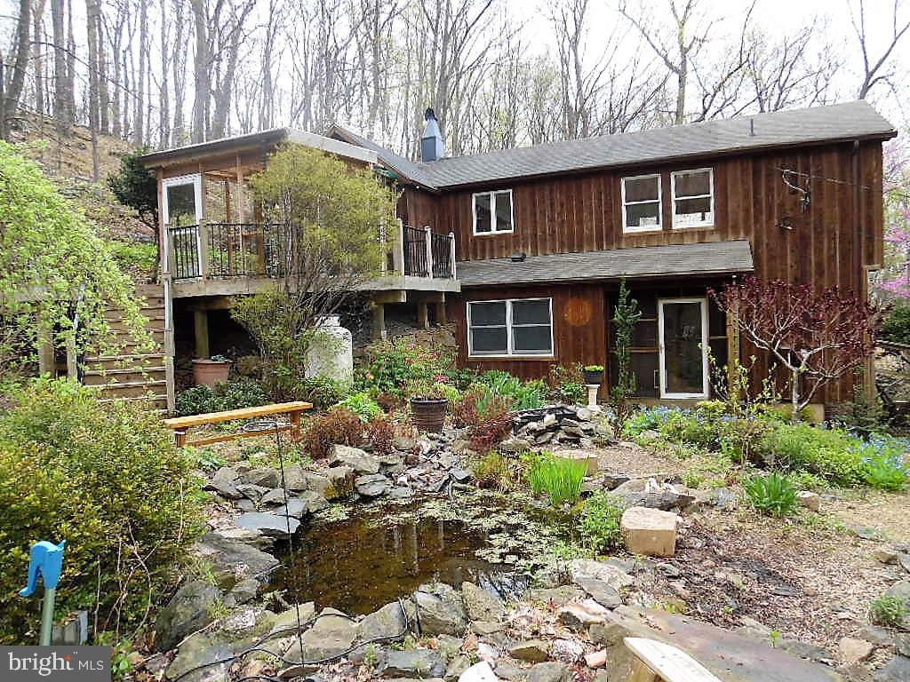 610 Wilderness Road Linden, VA 22642 - Photo 51 of 68 Pond and rear view of the house and garden
