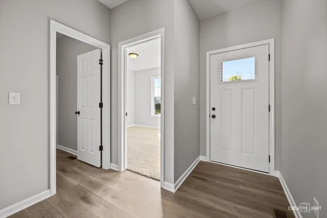 an empty room and wooden door