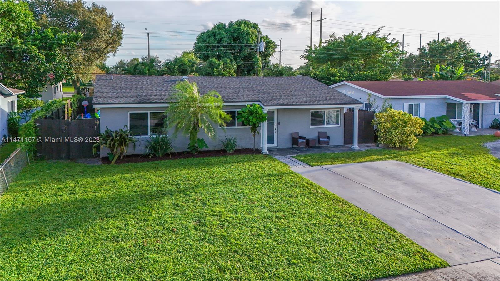 6750 Hope Street Hollywood, FL 33024 - Photo 19 of 54 a view of a yard in front of a house