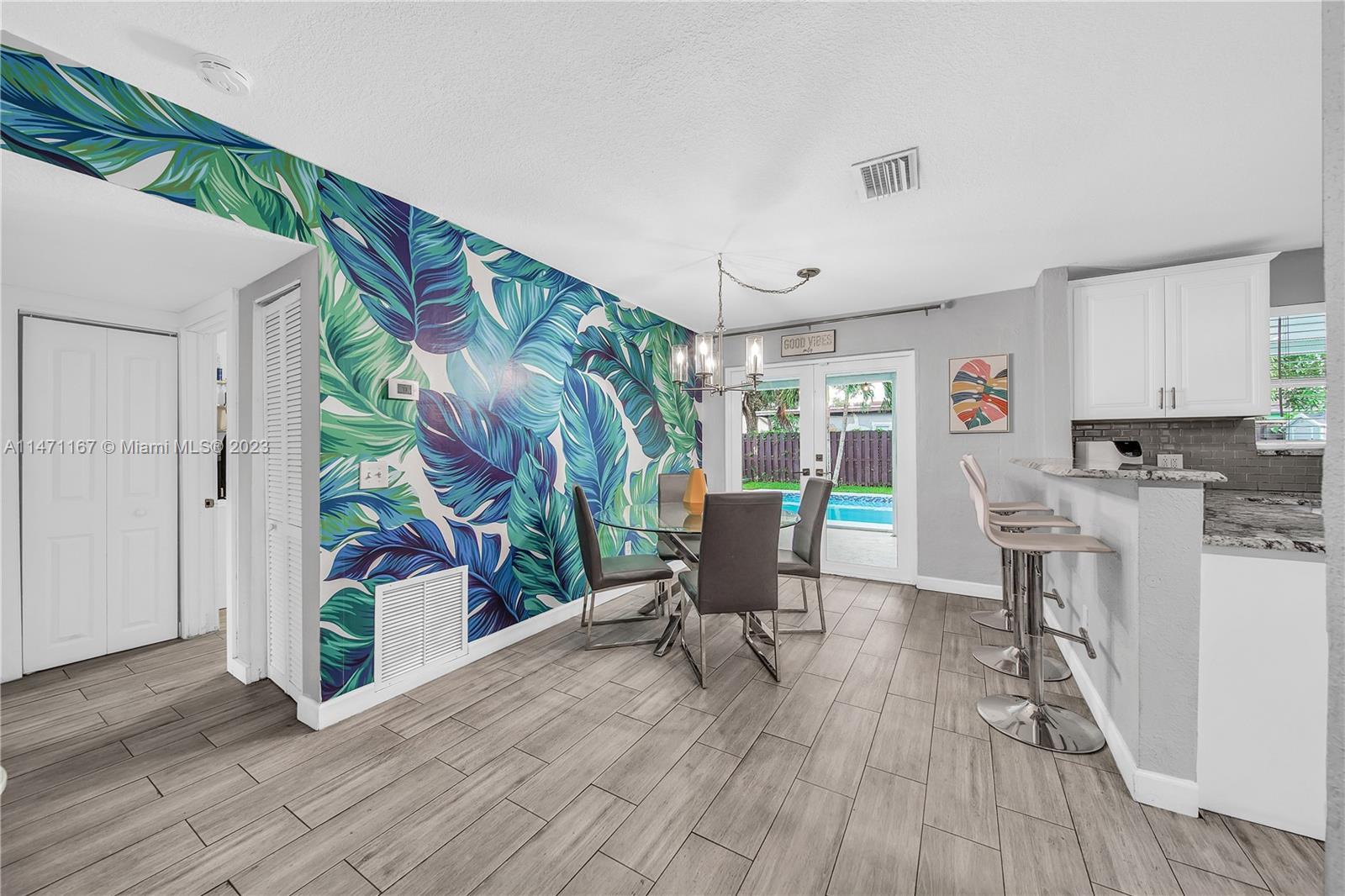 6750 Hope Street Hollywood, FL 33024 - Photo 33 of 54 a living room with furniture and a wooden floor