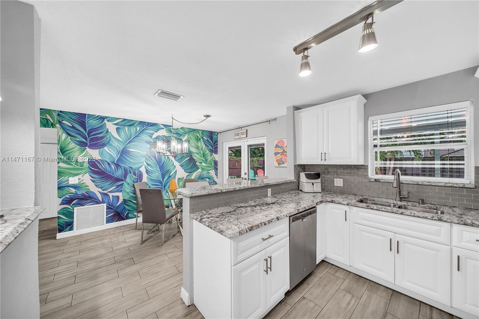 6750 Hope Street Hollywood, FL 33024 - Photo 40 of 54 a kitchen with a sink stove and cabinets