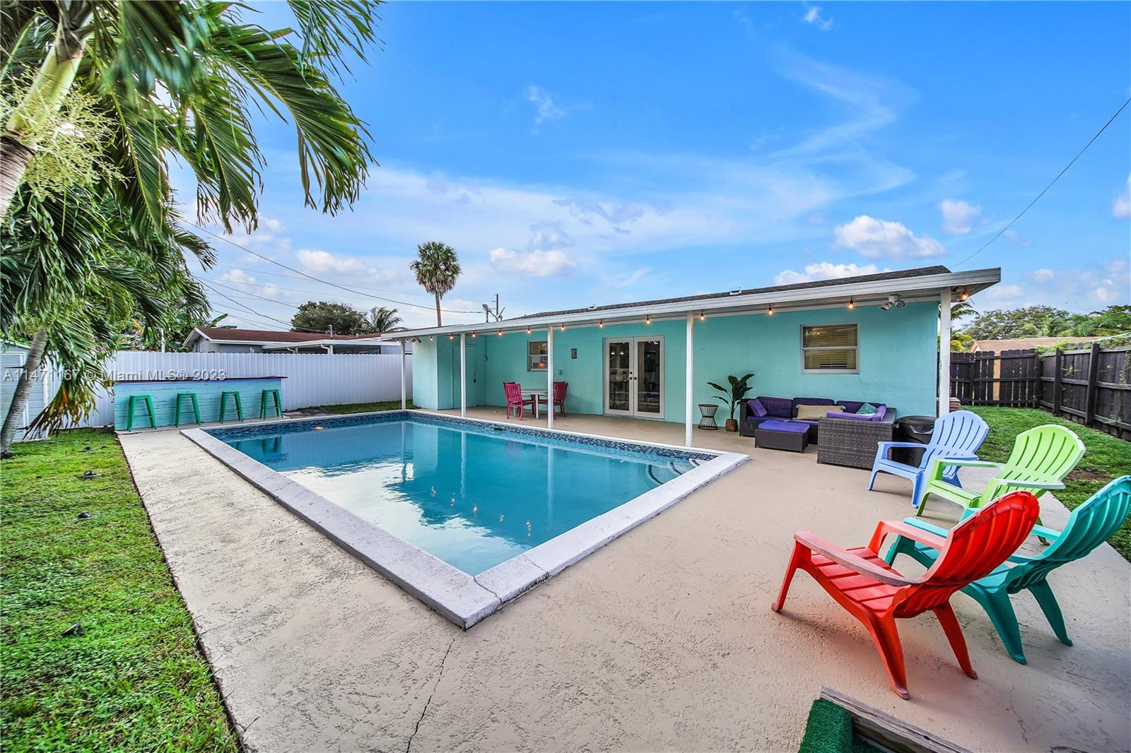 6750 Hope Street Hollywood, FL 33024 - Photo 4 of 54 a view of a chairs and tables in the backyard