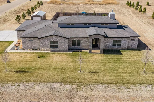 an aerial view of residential houses with outdoor space