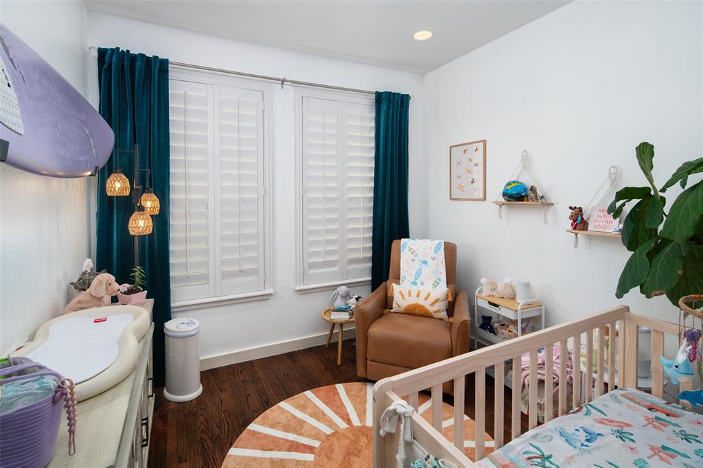 2411 North Hall Street, Unit 38 Dallas, TX 75204 - Photo 21 of 26 Bedroom with dark wood-style flooring and recessed lighting
