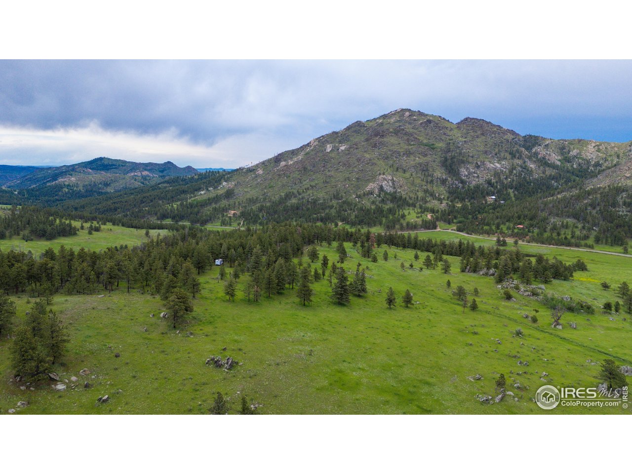 0 Old Flowers Road Bellvue, CO 80512 - Photo 23 of 40 a open area with mountains in the back