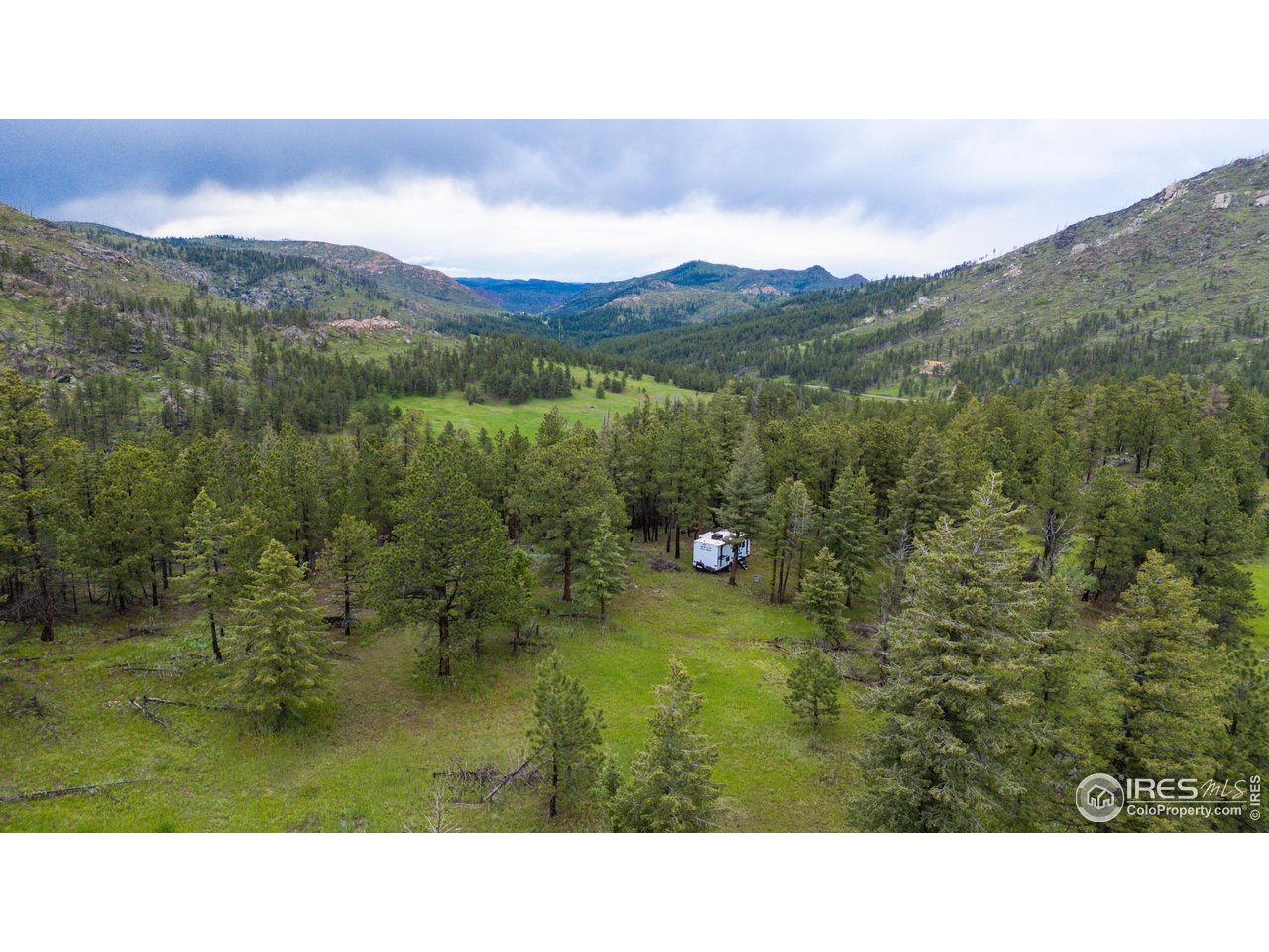 0 Old Flowers Road Bellvue, CO 80512 - Photo 25 of 40 a open area with mountains in the background