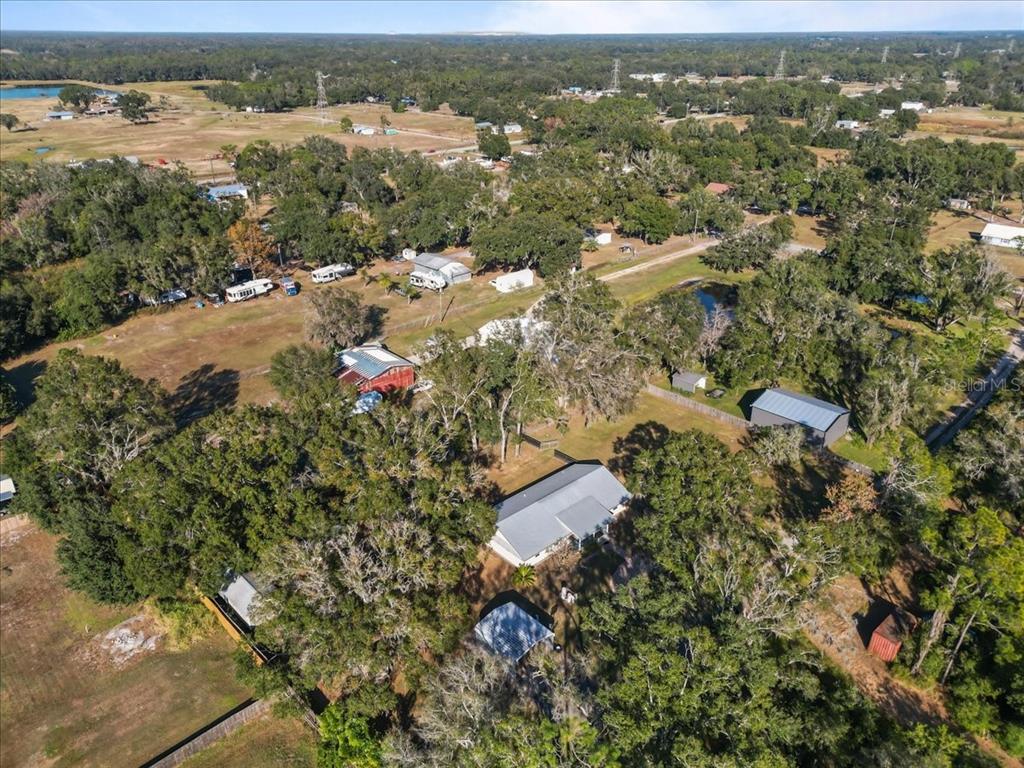 4805 Cooper Road Plant City, FL 33565 - Photo 3 of 45 an aerial view of residential houses with outdoor space and trees